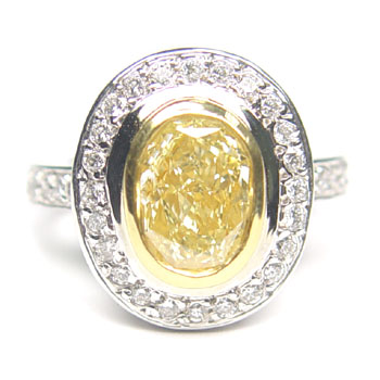 View 1.83ct Oval Fancy L. Yellow Ring